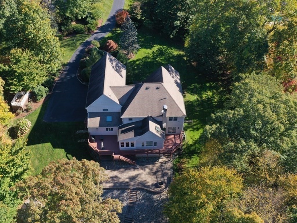 16 Steel Road Hopedale, MA 01747 - Photo 41 of 42 an aerial view of a house with a yard and large trees