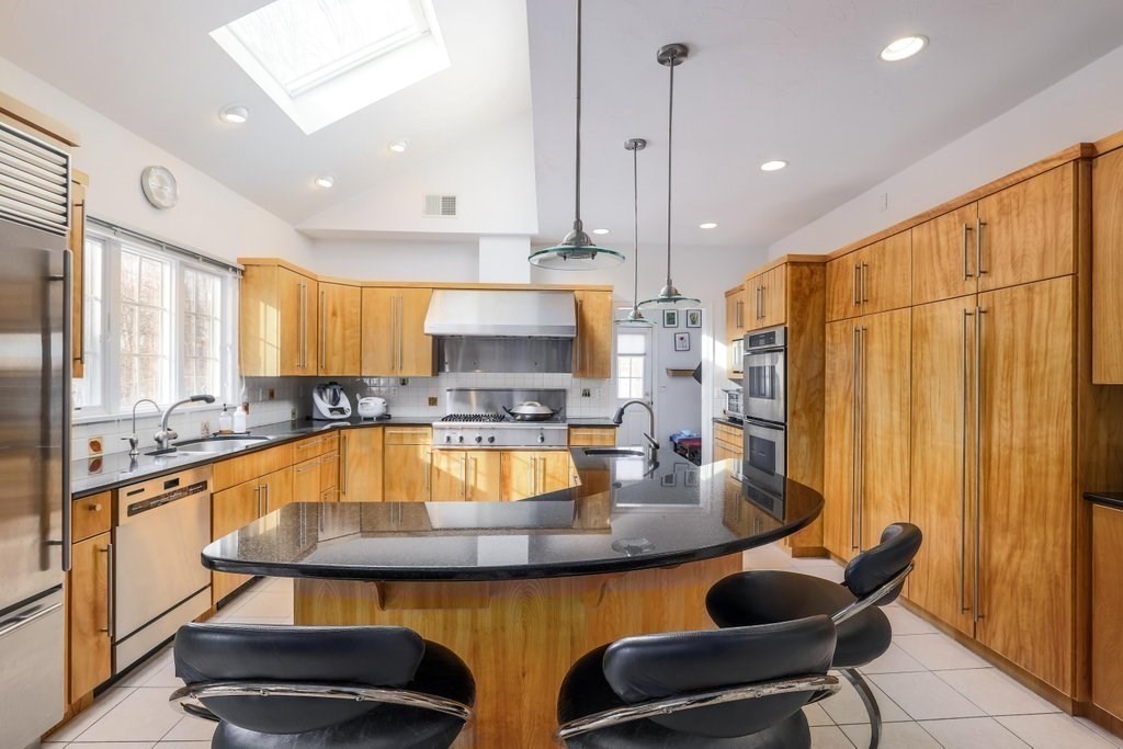16 Steel Road Hopedale, MA 01747 - Photo 5 of 42 a kitchen with stainless steel appliances granite countertop a sink a stove and a refrigerator