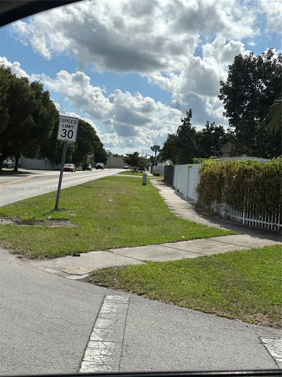 13200 Southwest 264th Street, Unit MAIN Homestead, FL 33032 - Photo 20 of 20 a view of a garden with green space