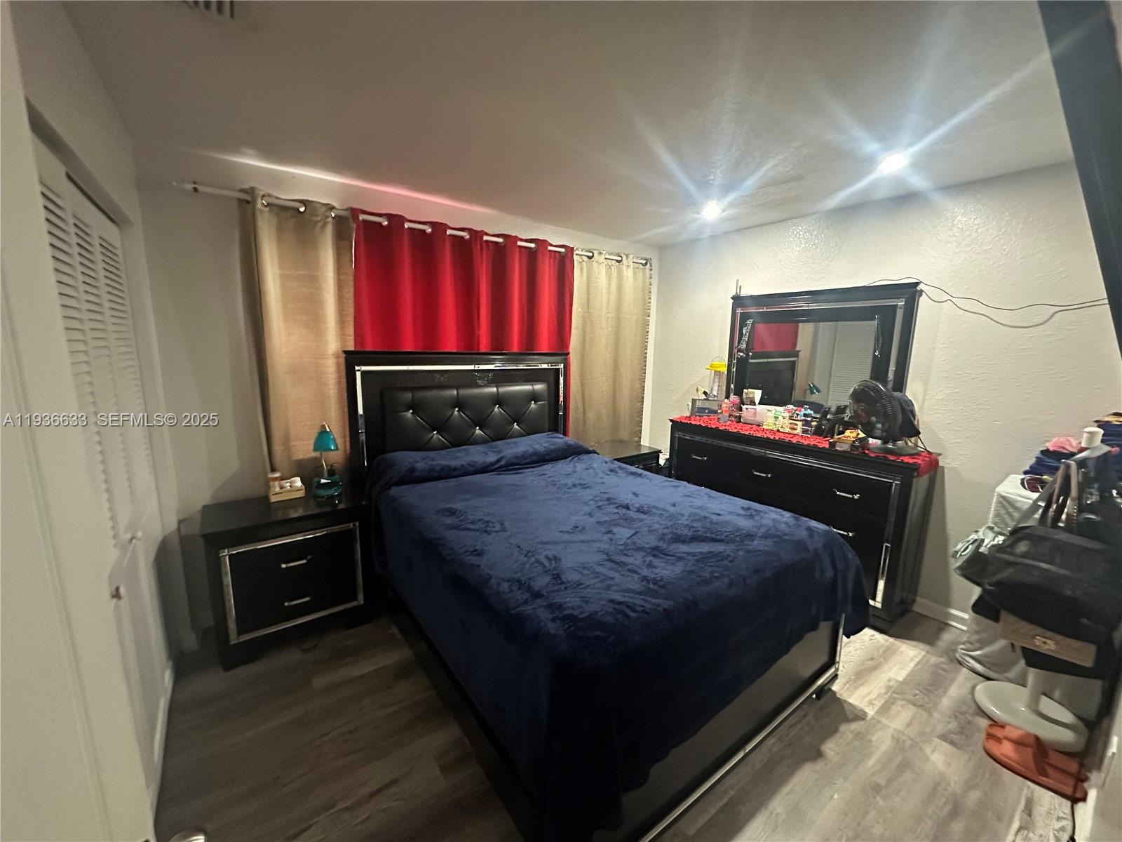 13200 Southwest 264th Street, Unit MAIN Homestead, FL 33032 - Photo 8 of 20 a bedroom with a bed and a television