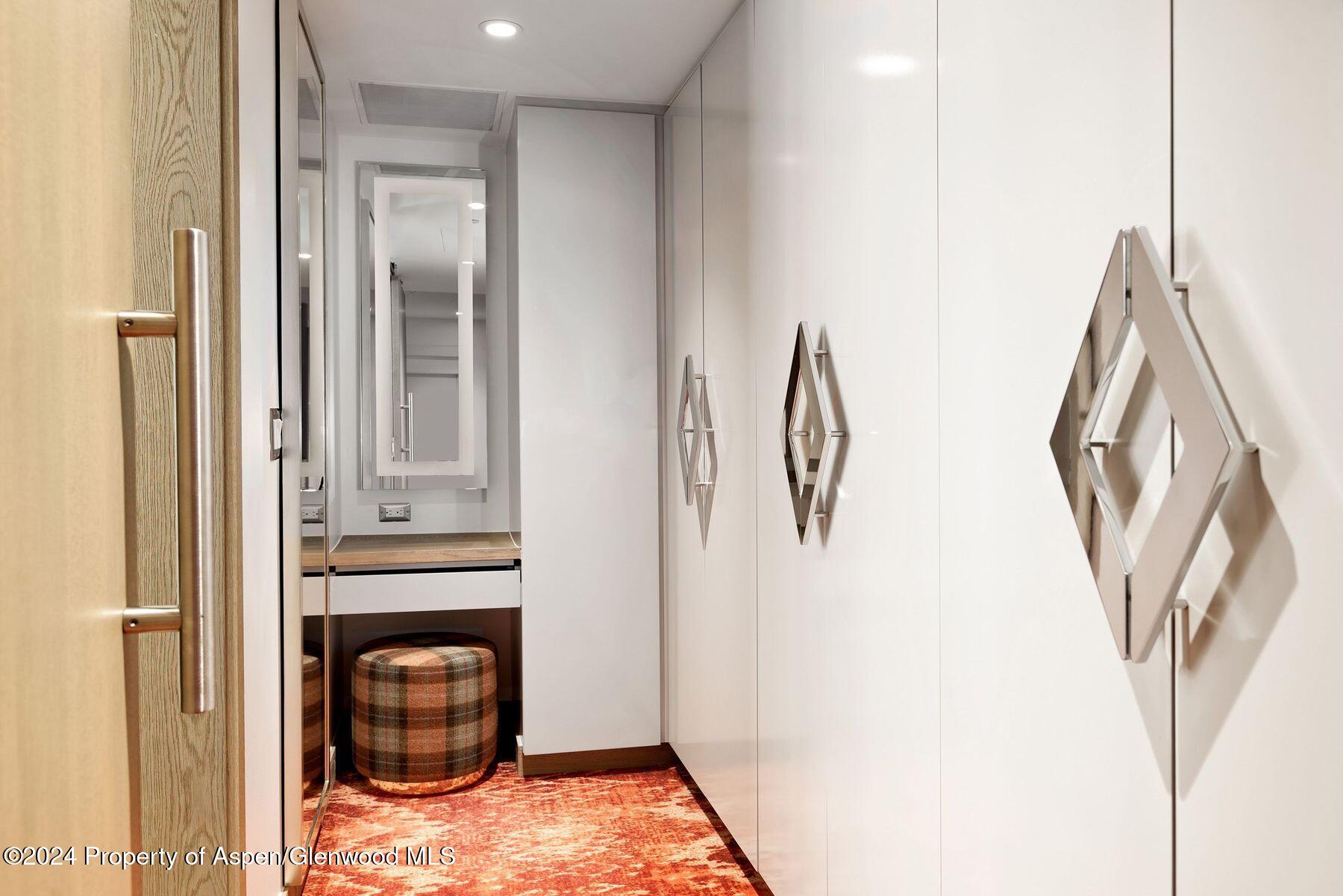 550 South Spring Street Aspen, CO 81611 - Photo 2 of 20 a view of a bedroom with a washer and dryer