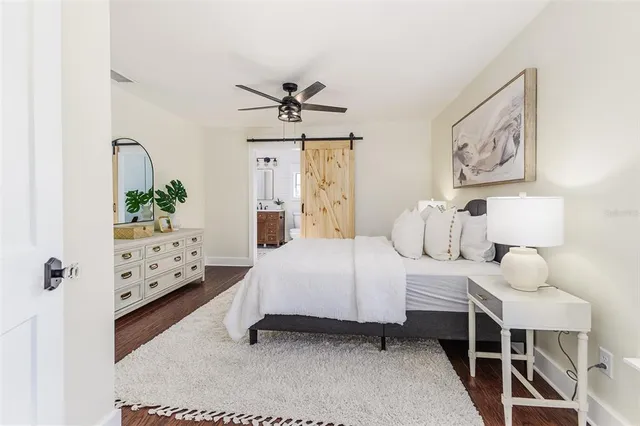 a bedroom with furniture and a baby crib