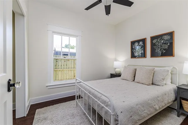 a bedroom with a bed and a window