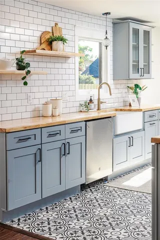a bathroom with a sink a mirror and shower