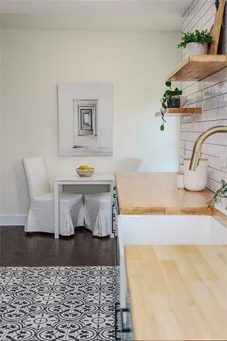 a living room with furniture and a rug