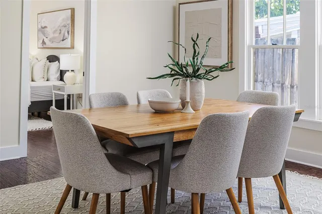 a view of a dining room with furniture and window