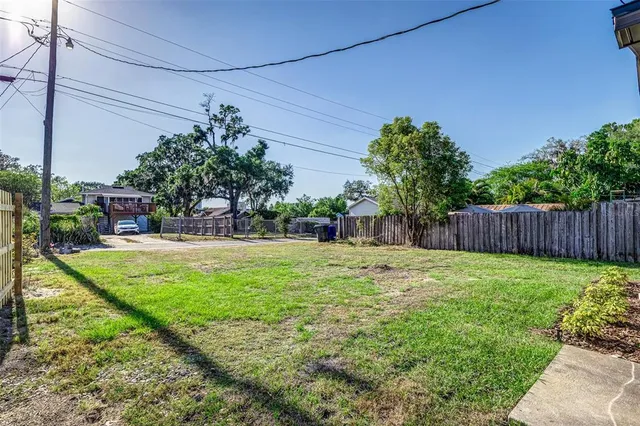 a backyard of a house with lots of green space