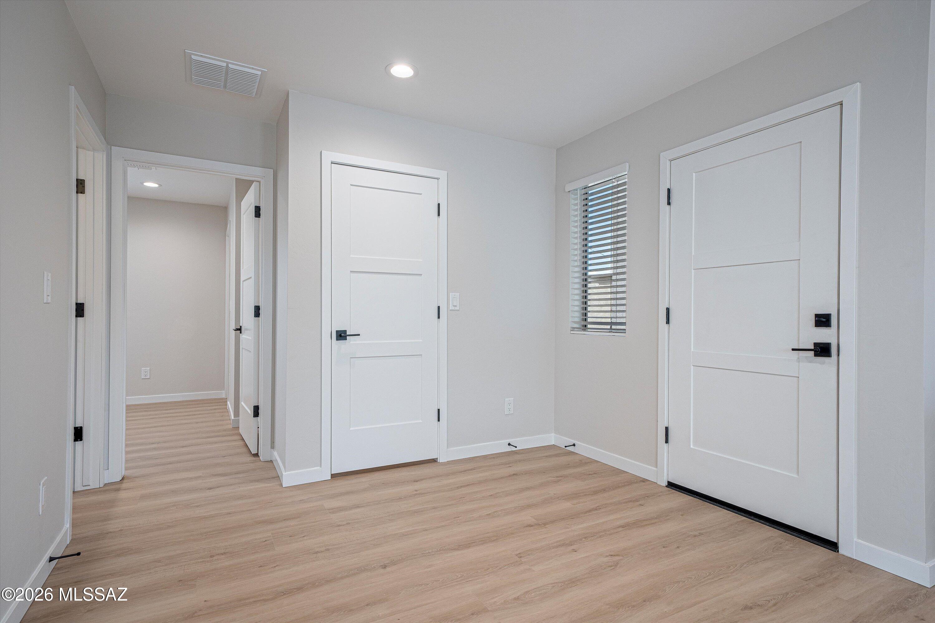 739 North Queen Avenue, Unit 2 Tucson, AZ 85705 - Photo 18 of 28 a view of empty room with wooden floor