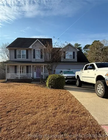 a view of a car parked in front of a house