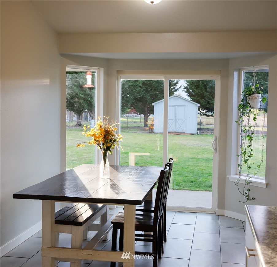 18041 Daryl Lane Southwest Rochester, WA 98579 - Photo 12 of 29 a dining room with furniture and window
