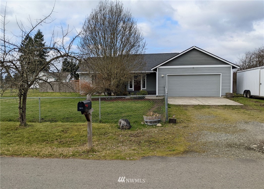 18041 Daryl Lane Southwest Rochester, WA 98579 - Photo 2 of 29 a view of a house with backyard and trees