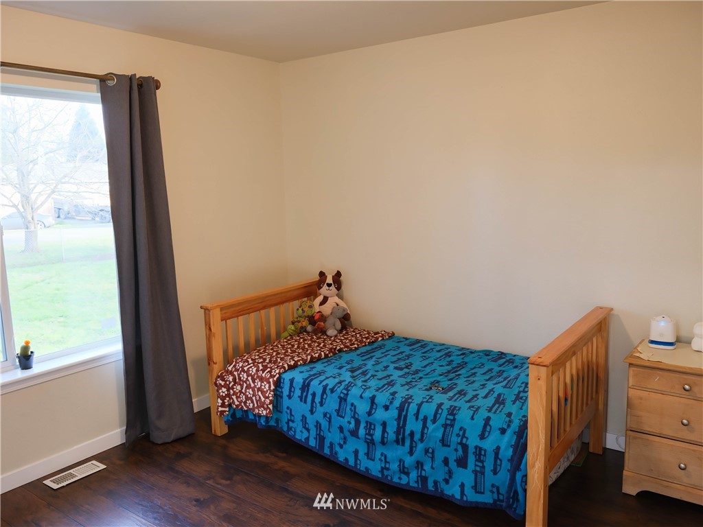 18041 Daryl Lane Southwest Rochester, WA 98579 - Photo 24 of 29 a bedroom with a bed and a window