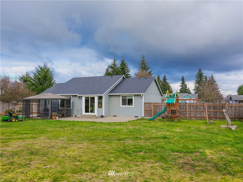18041 Daryl Lane Southwest Rochester, WA 98579 - Photo 6 of 29 a view of a house with a yard and plants