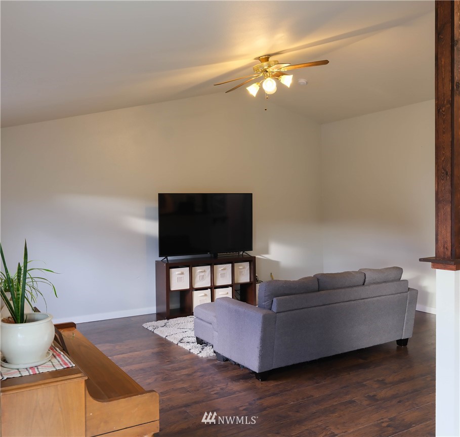 18041 Daryl Lane Southwest Rochester, WA 98579 - Photo 10 of 29 a living room with furniture and a flat screen tv