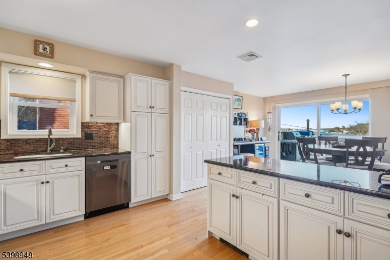 305 Kingsland Road Landing, NJ 07850 - Photo 11 of 40 a kitchen with white cabinets and sink