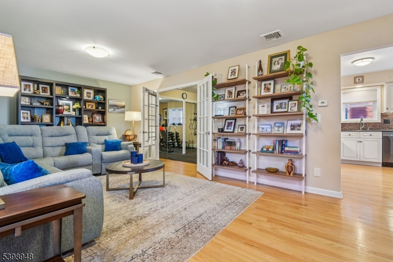 305 Kingsland Road Landing, NJ 07850 - Photo 14 of 40 a living room with furniture and a book shelf
