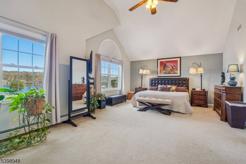305 Kingsland Road Landing, NJ 07850 - Photo 19 of 40 a bedroom with furniture and a chandelier