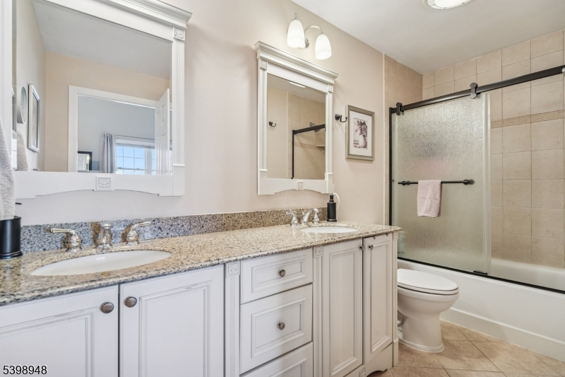 305 Kingsland Road Landing, NJ 07850 - Photo 23 of 40 a bathroom with a granite countertop sink toilet and shower