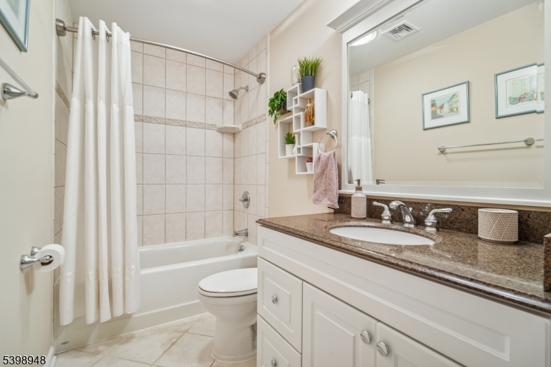 305 Kingsland Road Landing, NJ 07850 - Photo 25 of 40 a bathroom with a granite countertop bathtub sink vanity mirror and toilet