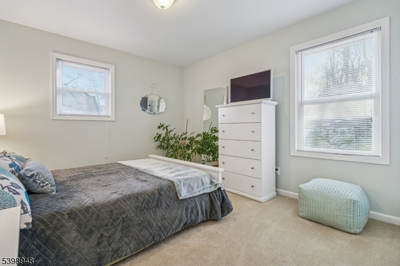 305 Kingsland Road Landing, NJ 07850 - Photo 26 of 40 a bedroom with a bed and a flat screen tv