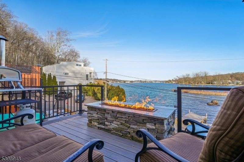 305 Kingsland Road Landing, NJ 07850 - Photo 32 of 40 a view of a balcony with wooden floor outdoor seating and city view