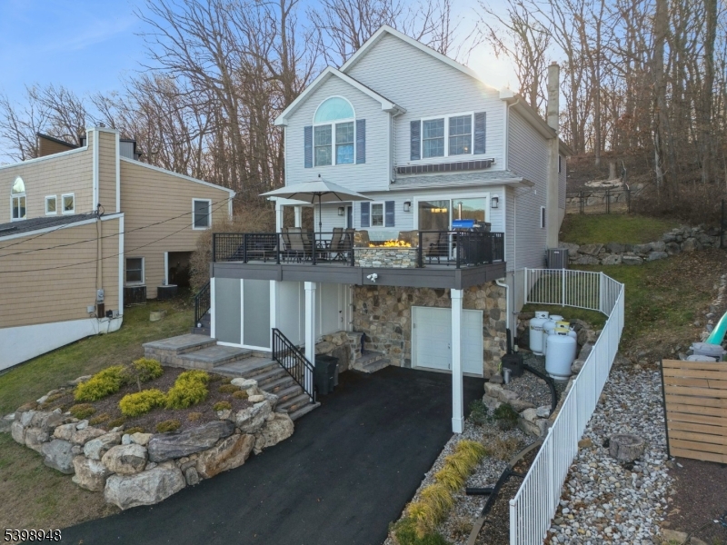 305 Kingsland Road Landing, NJ 07850 - Photo 35 of 40 a front view of a house with a yard patio and fire pit