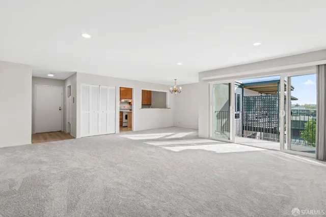 a view of an empty room with a closet