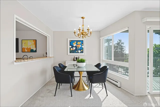 a bathroom with a window and a mirror