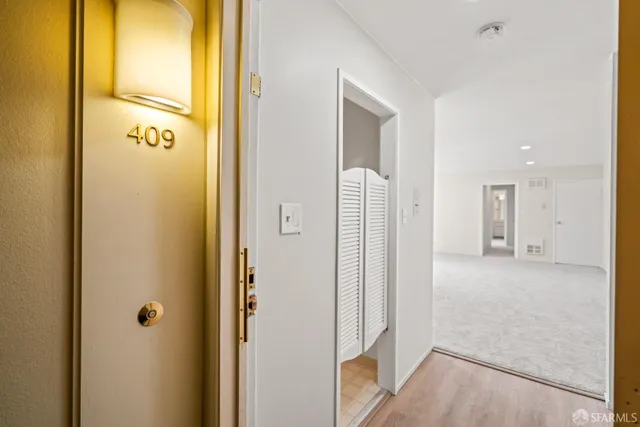 a view of a bathroom from a hallway
