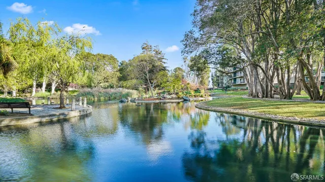 a view of a swimming pool with a yard