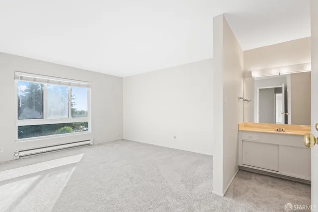 a bedroom with bed and a window