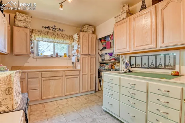 a kitchen with cabinets and window