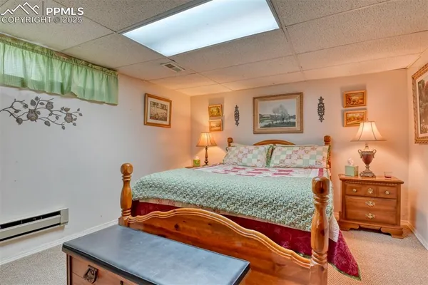 a bedroom with a bed and dresser