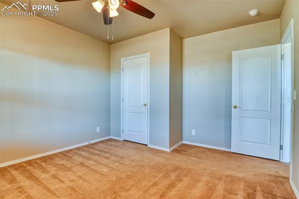 a bathroom with a granite countertop sink toilet mirror and shower