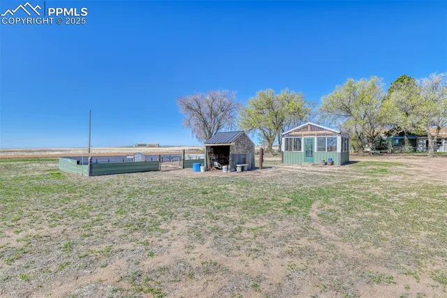 a view of a yard with a deck