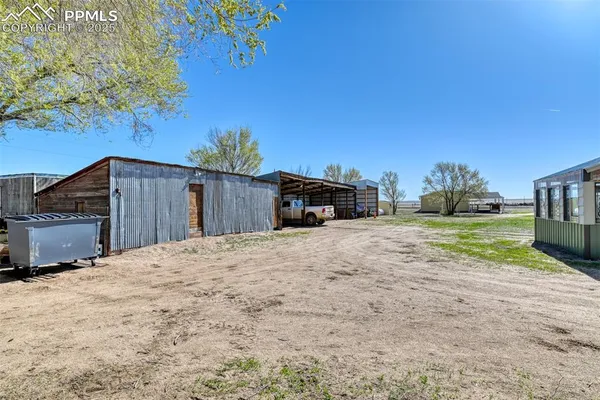 a view of a house with a yard and garage