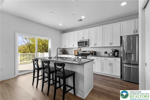 a utility room with cabinets and sink