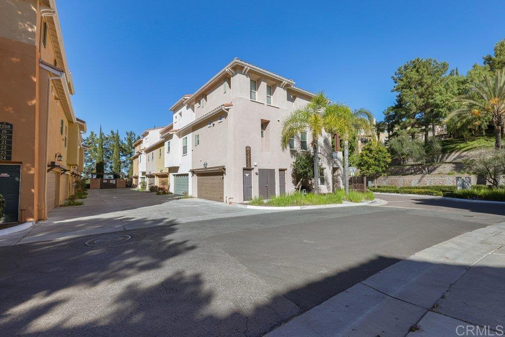2204 Huntington Point Road, Unit 13 Chula Vista, CA 91914 - Photo 14 of 28 a front view of a house with a yard