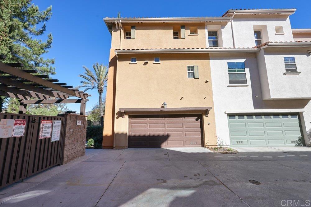2204 Huntington Point Road, Unit 13 Chula Vista, CA 91914 - Photo 15 of 28 a front view of a house with a garden