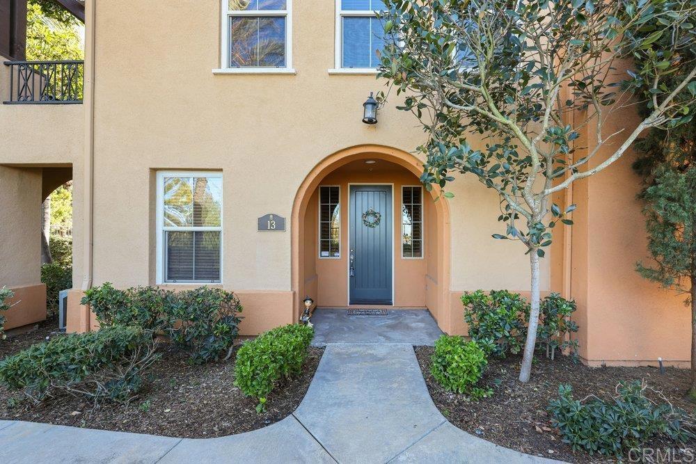 2204 Huntington Point Road, Unit 13 Chula Vista, CA 91914 - Photo 16 of 28 a front view of a house with garden