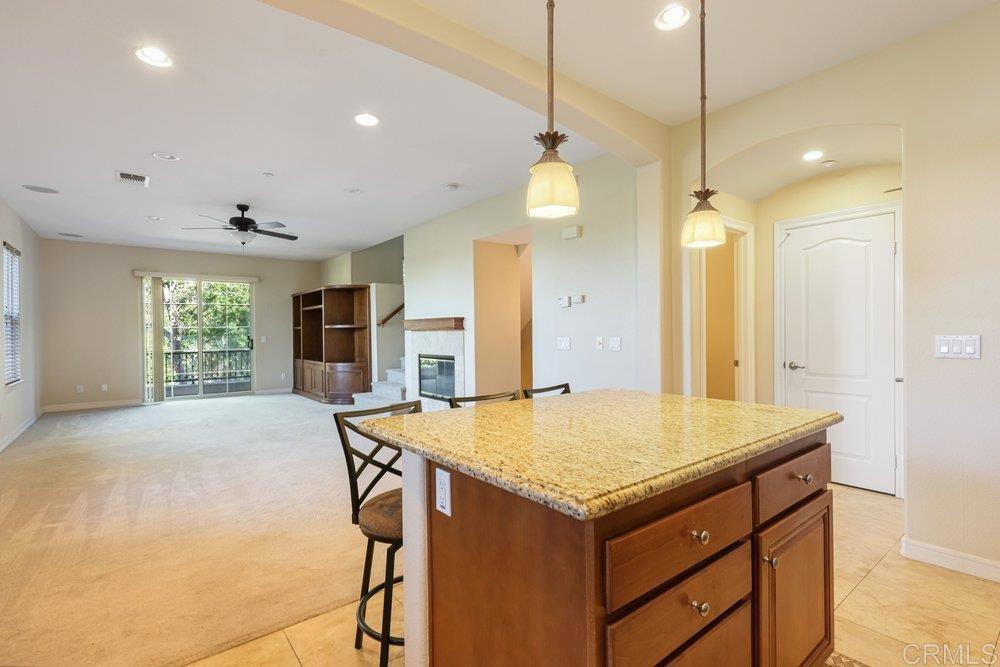 2204 Huntington Point Road, Unit 13 Chula Vista, CA 91914 - Photo 27 of 28 a kitchen with a table and chairs in it