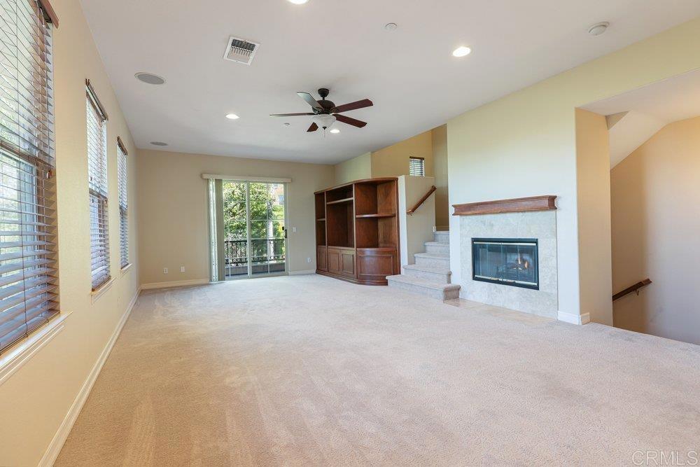 2204 Huntington Point Road, Unit 13 Chula Vista, CA 91914 - Photo 3 of 28 a view of an empty room with a fireplace and a window