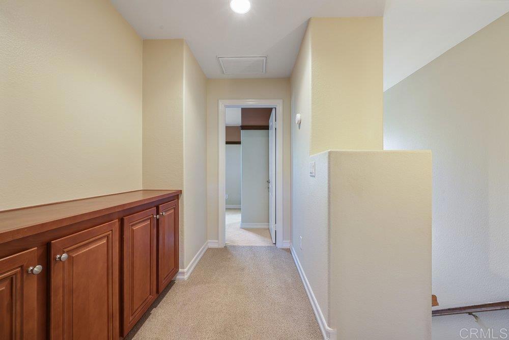 2204 Huntington Point Road, Unit 13 Chula Vista, CA 91914 - Photo 8 of 28 a view of a hallway with wooden floor