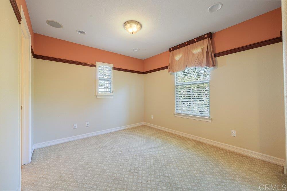 2204 Huntington Point Road, Unit 13 Chula Vista, CA 91914 - Photo 9 of 28 a view of an empty room with a window