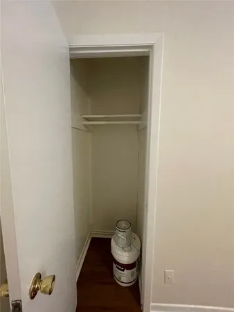 a bathroom with a granite countertop toilet and a sink