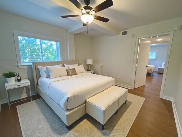 a bedroom with a bed and window