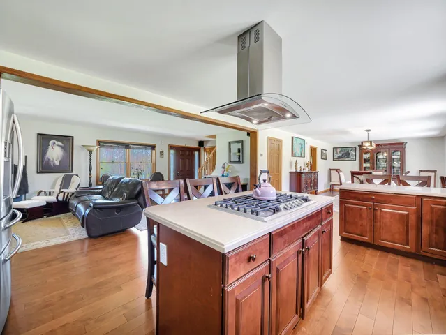 a bedroom with a bed and a tv on the dresser