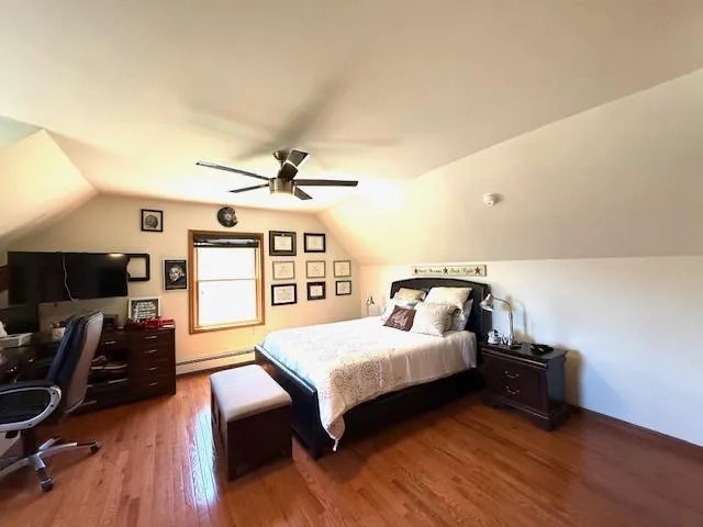 a bedroom with furniture and a window
