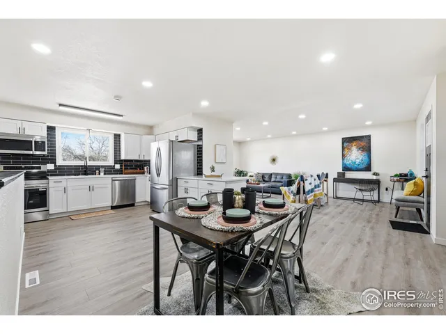 a kitchen with a table and chairs in it