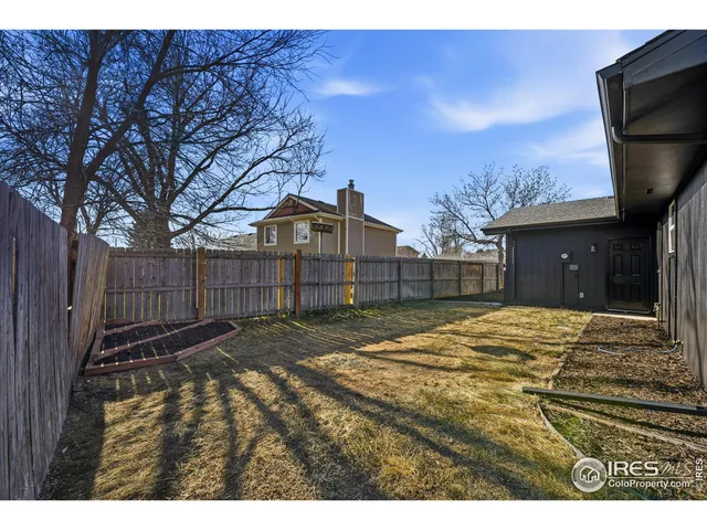 a view of a backyard of the house